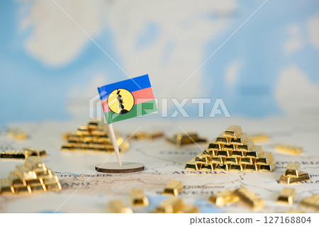 New Caledonian flag on a global map, surrounded by gleaming gold bars, symbolizing economic resources, global wealth, and financial investment with copy space New Caledonian flag on a global map, surrounded by gleaming gold bars, symbolizing economic resources, global wealth, and financial investment with copy space 127168804