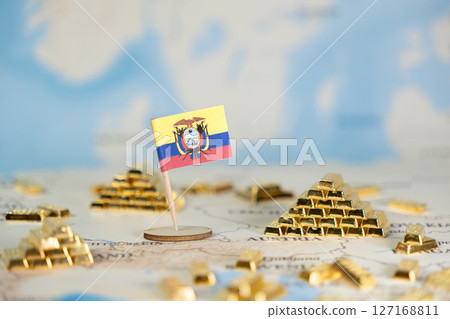 Ecuador's flag and scattered gold bars on a world map symbolize the nation's economic wealth, resources, and global financial standing, offering copy space 127168811