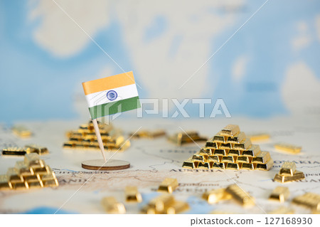 Indian flag on world map with gold bars, symbolizing national wealth, economic prosperity, and global investment opportunities, providing ample copy space 127168930