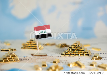 Iraqi flag miniature with Allahu Akbar (God is greatest) on a world map, surrounded by gold bars, symbolizing national wealth and economic strength Iraqi flag miniature with Allahu Akbar (God is greatest) on a world map, surrounded by gold bars, symbolizing national wealth and economic strength 127168935