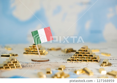 Italian flag pinned on a world map with numerous gold bars, symbolizing national wealth, financial stability, and global economic investment with copy space 127168959