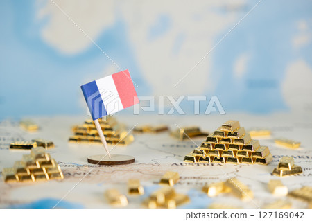 French flag with scattered gold bars on a European map, depicting national wealth, economic prosperity, and global investment, offering ample clear copy space French flag with scattered gold bars on a European map, depicting national wealth, economic prosperity, and global investment, offering ample clear copy space 127169042