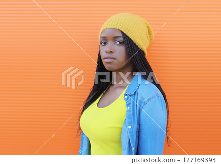 Fashionable young African woman in casual clothing, stylish modern black girl posing in the city Fashionable young African woman in casual clothing, stylish modern black girl posing in the city 127169393