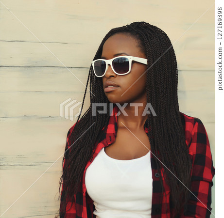 Fashionable young African woman in casual clothing, stylish modern black girl posing in the city Fashionable young African woman in casual clothing, stylish modern black girl posing in the city 127169398