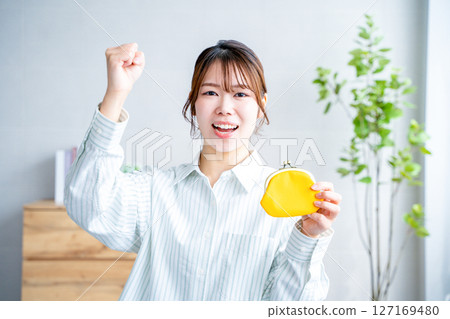 A woman with a wallet A woman with a wallet 127169480