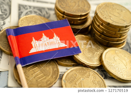 Cambodia flag on coin and banknote money, finance trading investment business currency. Cambodia flag on coin and banknote money, finance trading investment business currency. 127170519