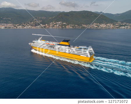 Big yellow passenger ferry goes on the Mediterranean Sea near Corsica island, France aerial view Cityscape Bastia port Big yellow passenger ferry goes on the Mediterranean Sea near Corsica island, France aerial view Cityscape Bastia port 127171072