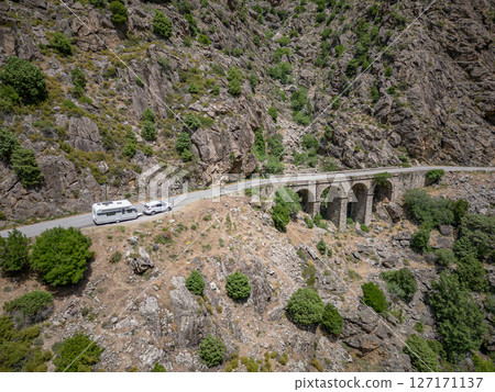 Camping Caravan driving through Canyon de la Ruda road Corsica down the pass monte Cino Camping Caravan driving through Canyon de la Ruda road Corsica down the pass monte Cino 127171137
