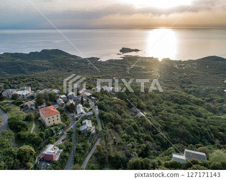 Aerial view car Roadtrip Winding road along rocky coast of Cap Corse peninsula on Corsica island France Aerial view car Roadtrip Winding road along rocky coast of Cap Corse peninsula on Corsica island France 127171143