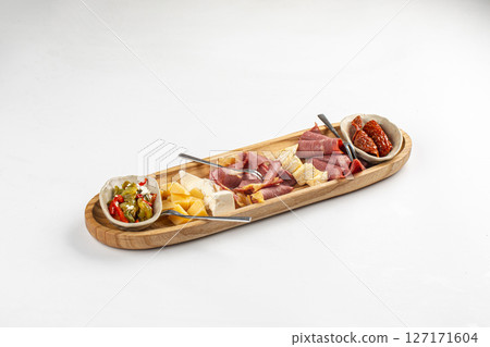 Portion of antipasti platter with cheese and meat 127171604