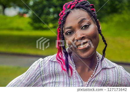 Happy African American Woman Outdoor Portrait Colorful Braids Smiling Happy African American Woman Outdoor Portrait Colorful Braids Smiling 127171642
