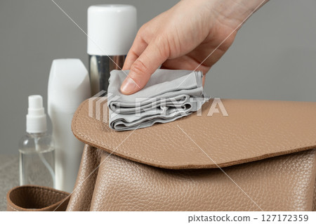 Cleaning a leather handbag, caring for leather accessories. 127172359