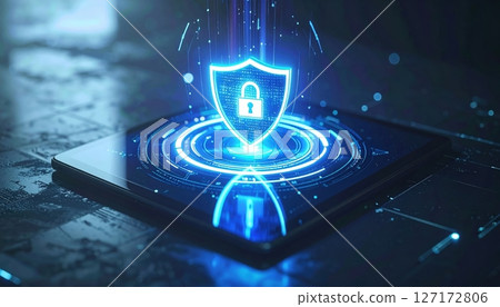 Digital security concept showing a bright glowing shield with a lock symbol floating above a modern smartphone screen in a high-tech environment 127172806