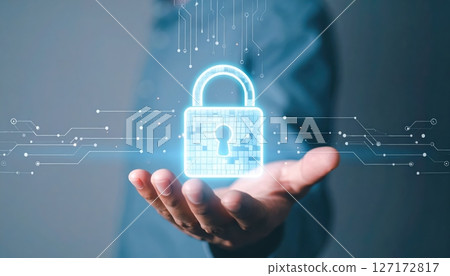Modern digital security concept with a glowing padlock symbol floating above a person's hand representing data protection and cyber security technology Modern digital security concept with a glowing padlock symbol floating above a person's hand representing data protection and cyber security technology 127172817