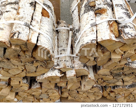firewood bundles for sale, perfect for winter warmth and outdoor activities in neighborhood market. firewood bundles for sale, perfect for winter warmth and outdoor activities in neighborhood market. 127172951