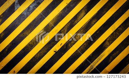 Yellow and black diagonal stripes that warn of danger due to old and dirty 127173243