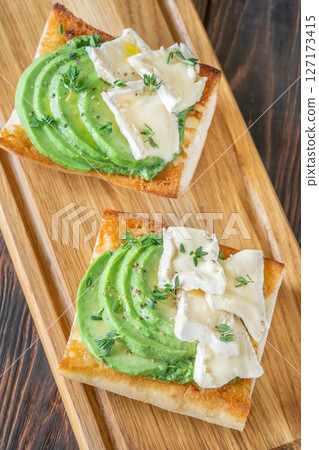 Ciabatta Sandwiches With Brie, Avocado, Creamy Spinach And Fresh Thyme Garnish 127173415
