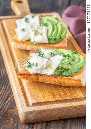Ciabatta Sandwiches With Brie, Avocado, Creamy Spinach And Fresh Thyme Garnish Ciabatta Sandwiches With Brie, Avocado, Creamy Spinach And Fresh Thyme Garnish 127173418