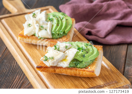 Ciabatta Sandwiches With Brie, Avocado, Creamy Spinach And Fresh Thyme Garnish Ciabatta Sandwiches With Brie, Avocado, Creamy Spinach And Fresh Thyme Garnish 127173419
