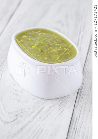 White bowl of salsa verde with zesty vibrant green and clean finish 127173423
