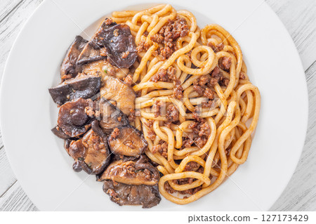 Unagi udon noodles served with beef and crispy garlic thyme shiitake Unagi udon noodles served with beef and crispy garlic thyme shiitake 127173429