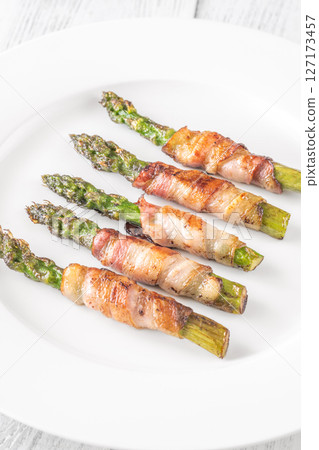 Crispy Fried Asparagus Wrapped In Bacon Served Simply On White Plate Crispy Fried Asparagus Wrapped In Bacon Served Simply On White Plate 127173457