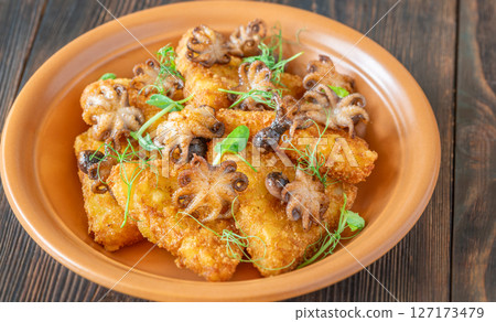 Golden Potato Rosti With Baby Octopuses And Fresh Pea Shoots Garnished Delicately Golden Potato Rosti With Baby Octopuses And Fresh Pea Shoots Garnished Delicately 127173479