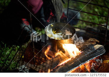 Solo camper eating ramen for midnight snack Solo camp Senior Solo camper eating ramen for midnight snack Solo camp Senior 127173532