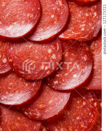 Background image of sliced pepperoni Background image of sliced pepperoni 127173721