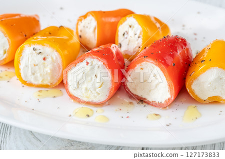 Colorful Baby Bell Peppers Stuffed With Cream Cheese on White Plate Colorful Baby Bell Peppers Stuffed With Cream Cheese on White Plate 127173833