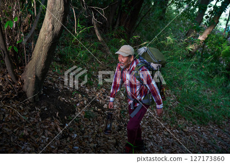 Hiking, mountain climbing, senior camper, dusk, solo camping, senior Hiking, mountain climbing, senior camper, dusk, solo camping, senior 127173860