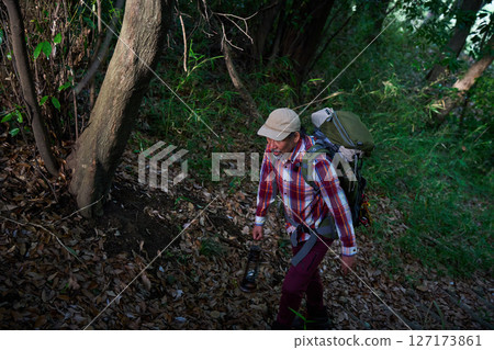 Hiking, mountain climbing, senior camper, dusk, solo camping, senior Hiking, mountain climbing, senior camper, dusk, solo camping, senior 127173861