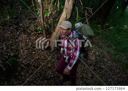 Hiking, mountain climbing, senior camper, dusk, solo camping, senior 127173864