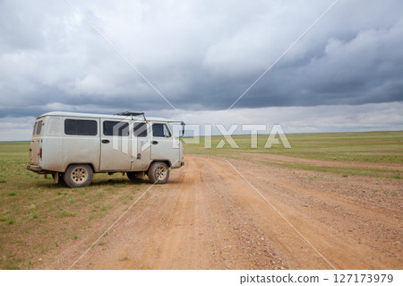 Off-road vehicles in remote region of Mongolia. Gobi desert area Off-road vehicles in remote region of Mongolia. Gobi desert area 127173979