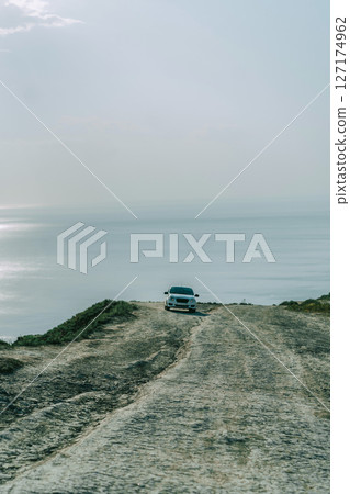 White Car on Coastal Cliff Road 127174962