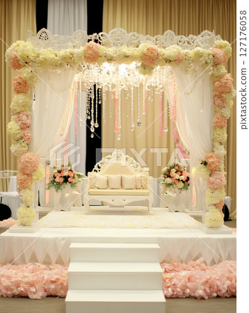 Elegant Wedding Stage Decor Peach White Flowers Crystal Chandelier Romantic Ceremony Setup Bridal Elegant Wedding Stage Decor Peach White Flowers Crystal Chandelier Romantic Ceremony Setup Bridal 127176058