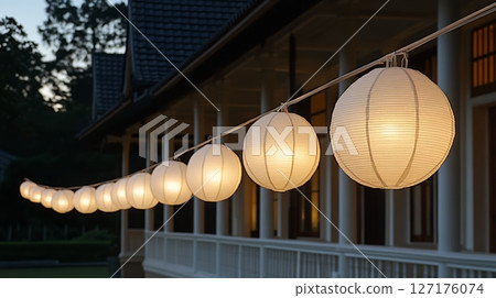 Elegant Outdoor String Lights Paper Lanterns Warm Evening Glow Romantic Ambiance Festive Decoration 127176074