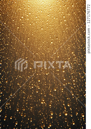 Golden rain drops fall against a dark background, illuminated by a warm glowing light. Abstract composition perfect for luxury, celebration, and festive design themes Golden rain drops fall against a dark background, illuminated by a warm glowing light. Abstract composition perfect for luxury, celebration, and festive design themes 127176772