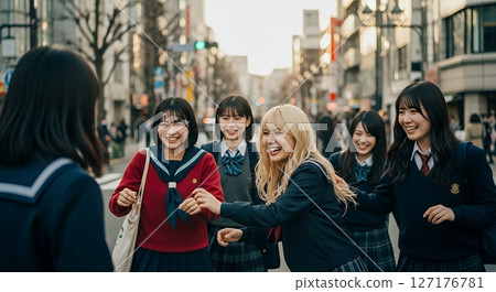 High school girls playing in the city after school High school girls playing in the city after school 127176781
