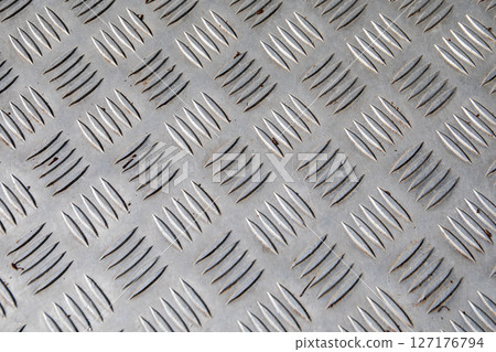 Textured Steel Tread Plate Surface with Diagonal Anti-Slip Pattern for Industrial Use 127176794
