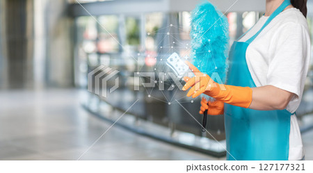 Pro cleaner uses modern tools in lobby. Pro cleaner uses modern tools in lobby. 127177321