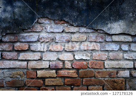 Close up of weathered orange brick wall with rough Close up of weathered orange brick wall with rough 127178126