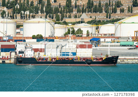 Oil tanker at Port of Barcelona with Montjuic cemetery backdrop 127178398