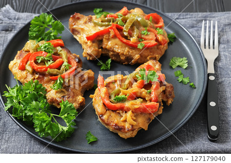pork chops topped with bell pepper cream gravy pork chops topped with bell pepper cream gravy 127179040