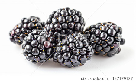 Perfectly ripe, dark blackberries arranged on a clean white background, highlighting their rich color and texture for healthy eating and fresh fruit concepts. 127179127