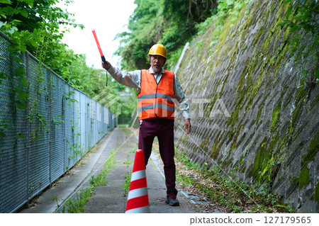 Traffic control, guidance, security guard, guard, under construction, guidance, senior Traffic control, guidance, security guard, guard, under construction, guidance, senior 127179565
