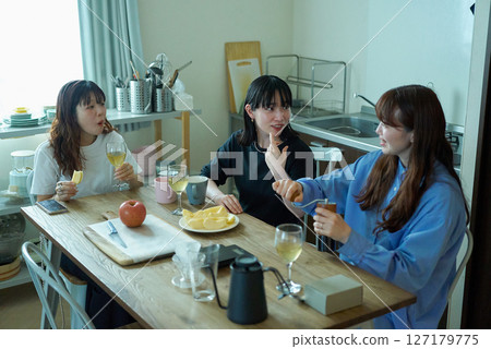 Young women having lively conversation 127179775