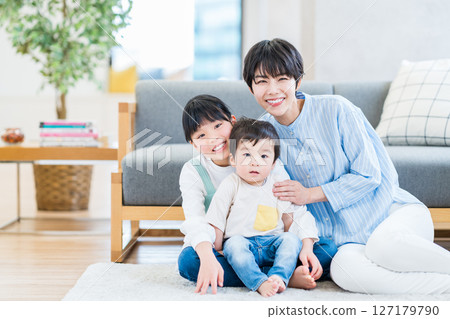 A family relaxing in the living room. A family relaxing in the living room. 127179790
