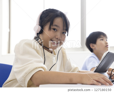 Female child using a tablet 127180150
