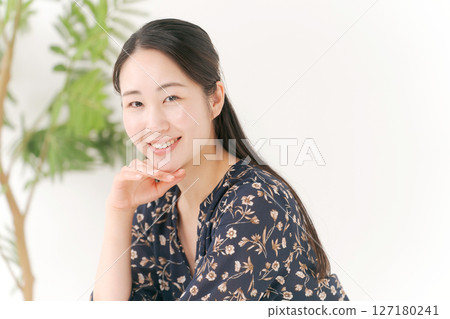 A young woman with a smile 127180241